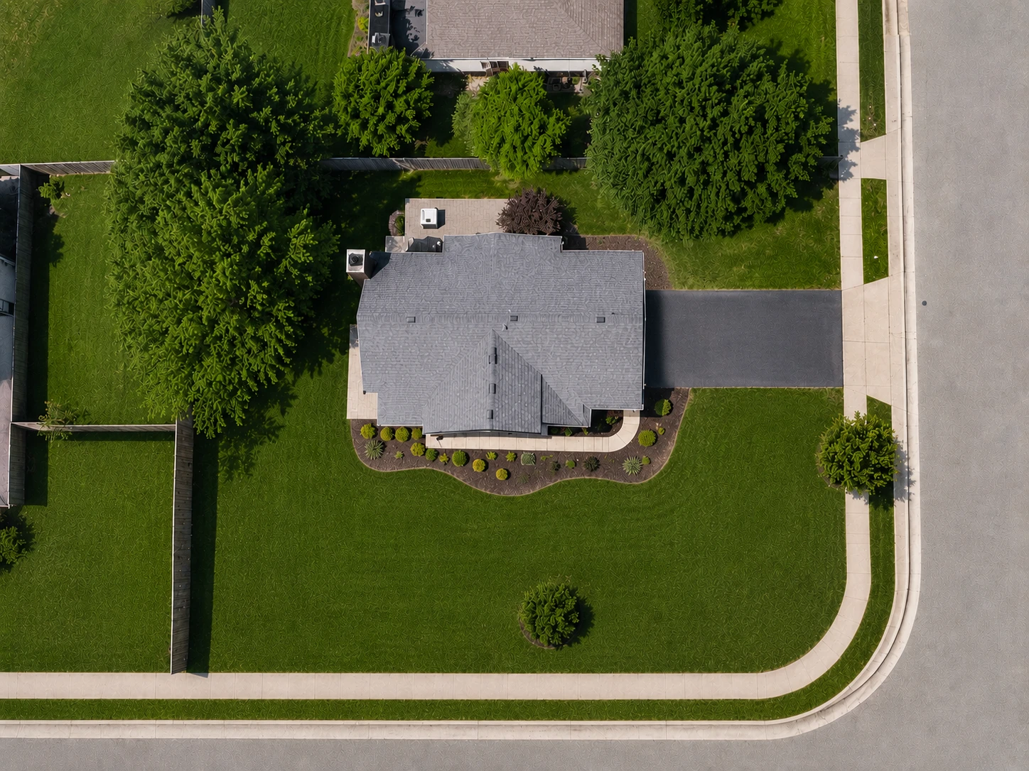 Aerial view of a residential property with the lawn, driveway, and roof each traced and measured as a separate area
